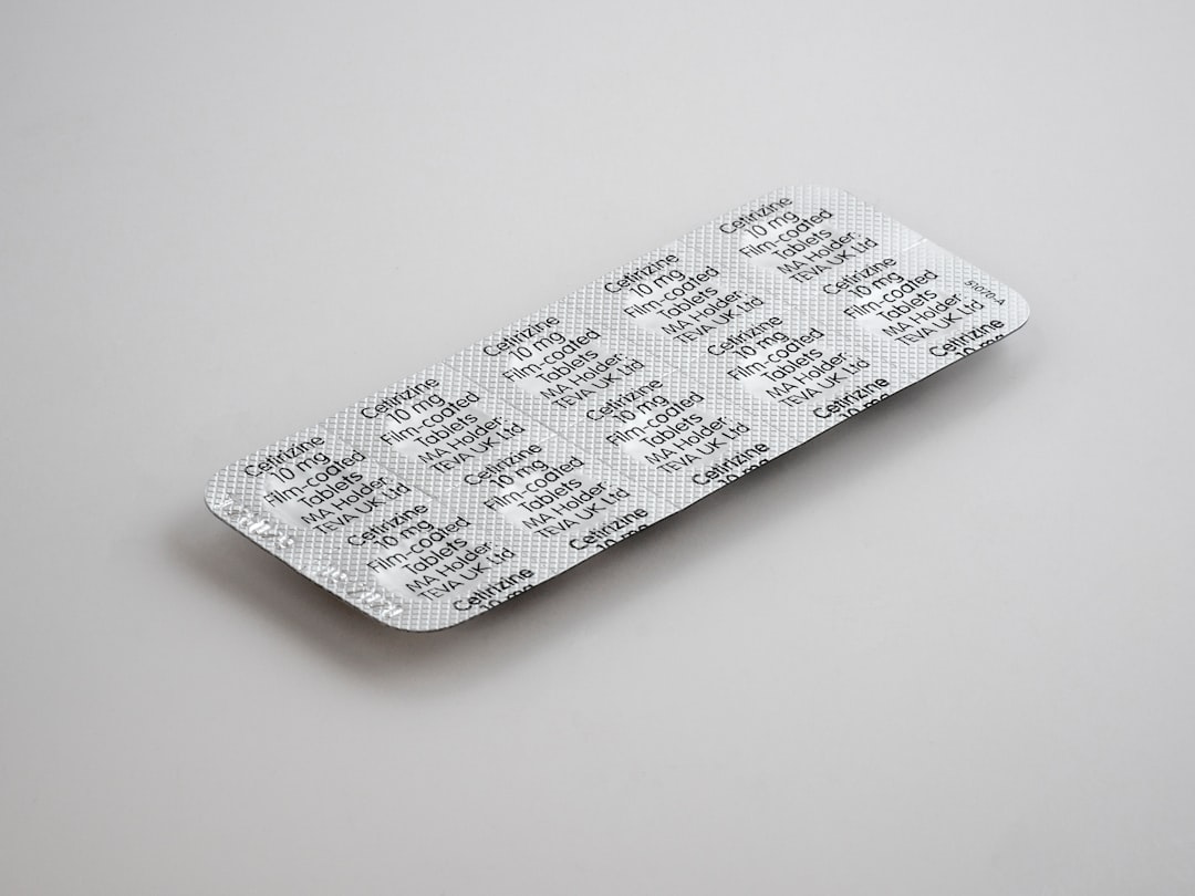 gray blister pack on white surface