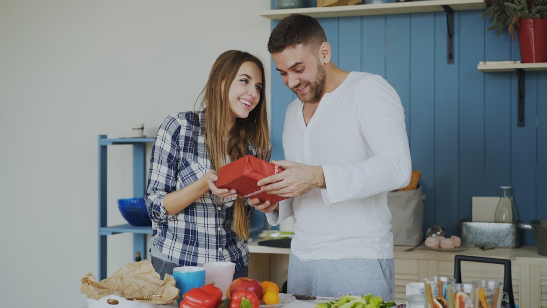 Couple looking at a red heart shaped object