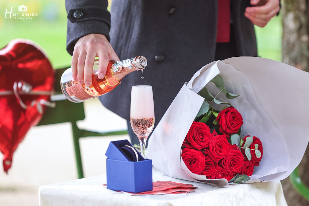 Man pours champagne for a romantic proposal.