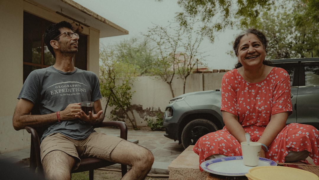 A man and a woman sitting on a patio