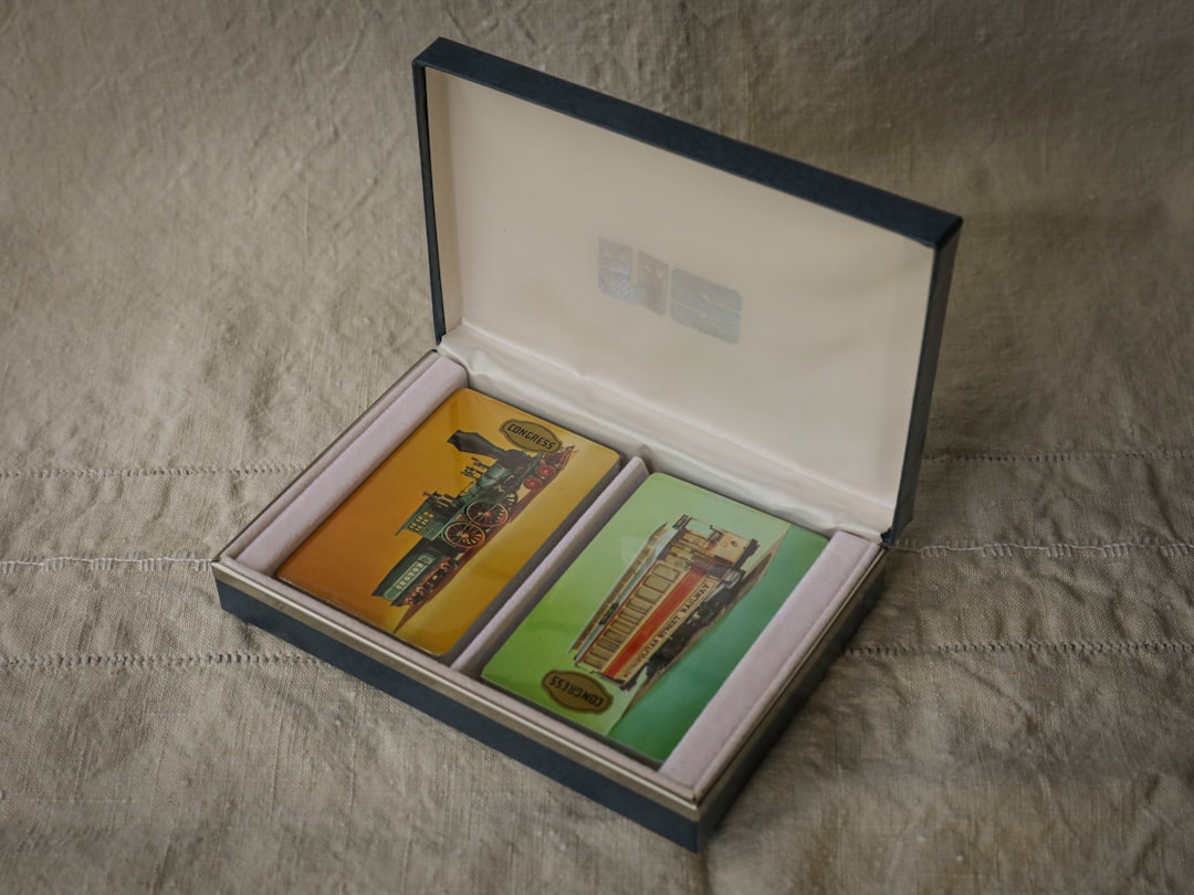 a couple of cards in a box on a bed