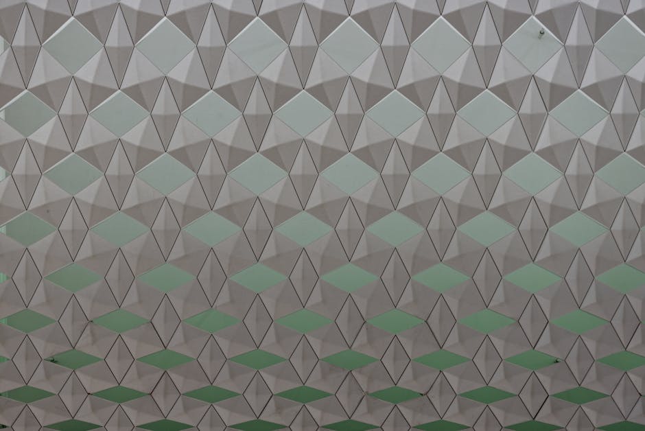 Seamless geometric pattern featuring diamond shapes in a soft color gradient.